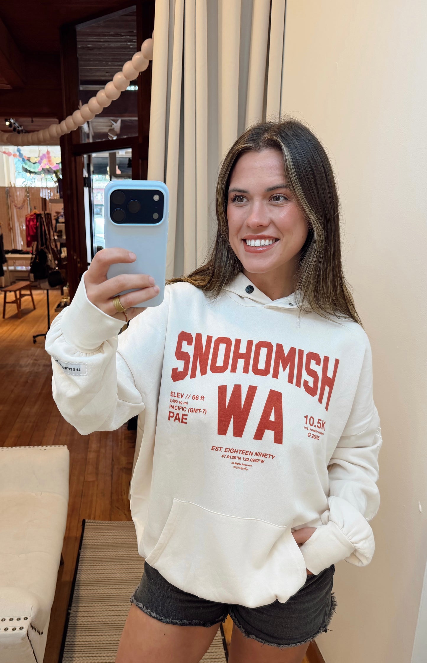 The Laundry Room Snohomish Hoodie- White with Red Writing